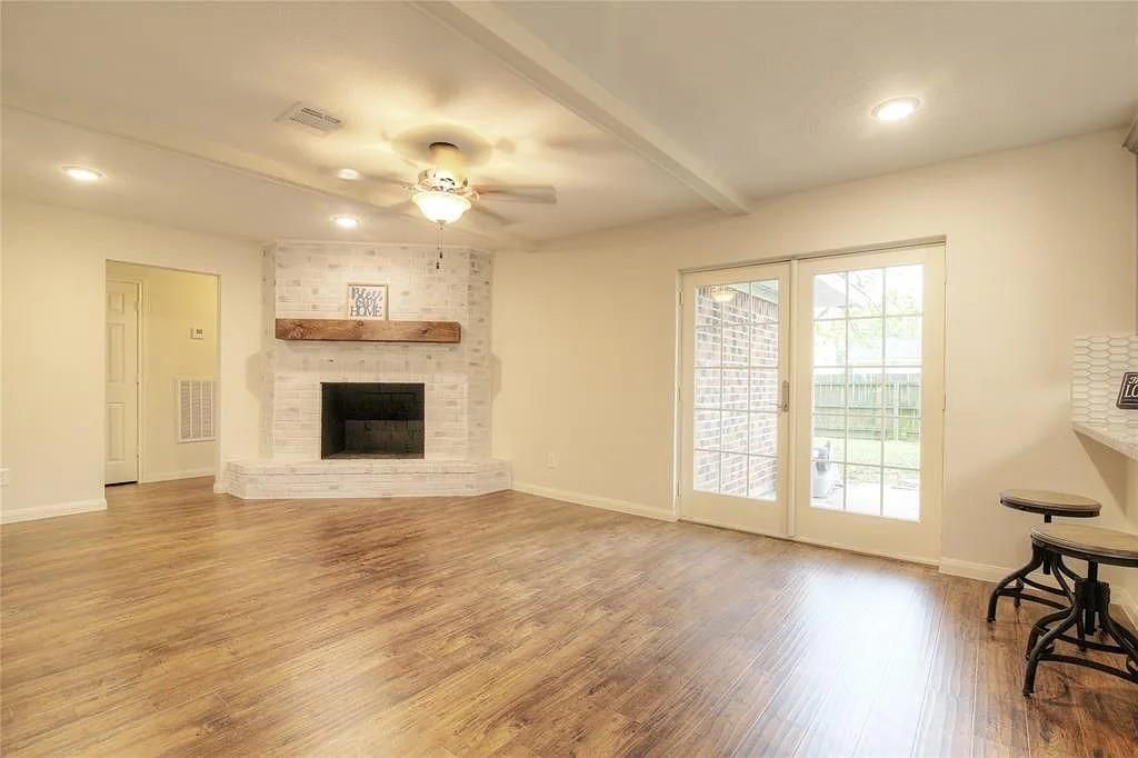 Empty room, Fireplace, Interior, Recessed Lighting, Stone Walls, Wood Texture Flooring
