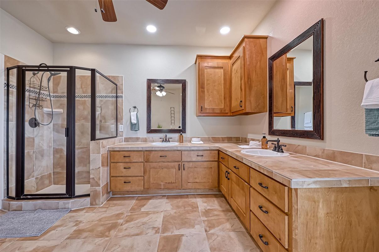 Bathroom, Dual Sink Vanities, Glass Shower, Interior, Recessed Lighting, Tile Countertops
