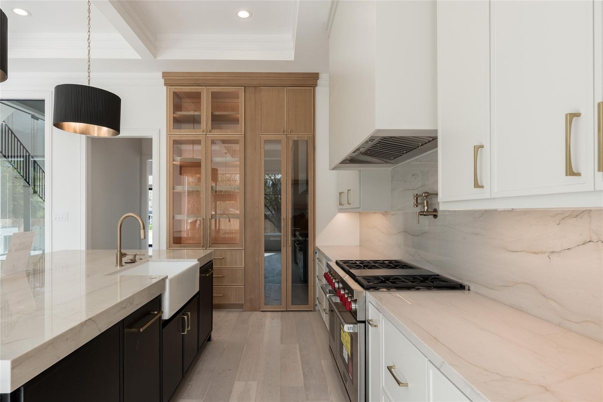 Interior, Kitchen, Marble Walls, Pendant Lights, Recessed Lighting, Stainless Steel Appliances, Wood Texture Flooring