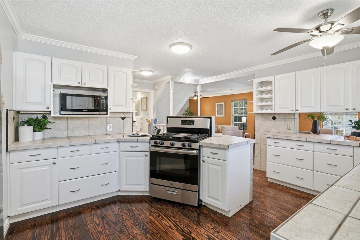 Interior, Kitchen, Recessed Lighting, Stainless Steel Appliances, Tile Countertops, Wood Texture Flooring