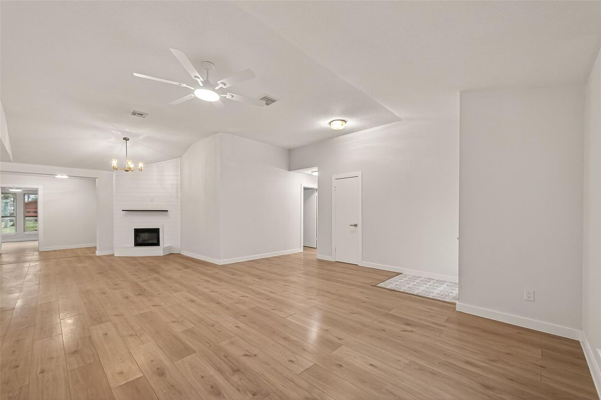 Chandelier, Empty room, Fireplace, Interior, Recessed Lighting, Wood Texture Flooring