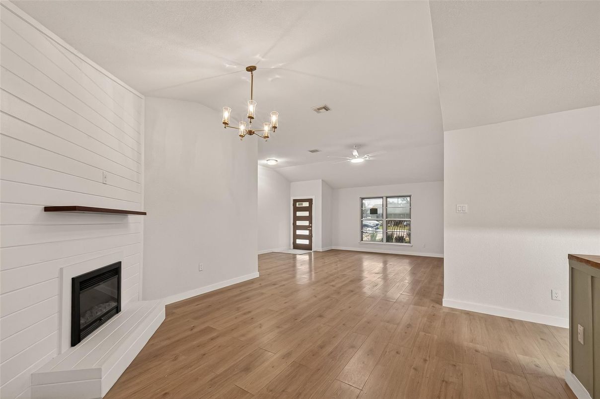 Empty room, Fireplace, Interior, Pendant Lights, Wood Texture Flooring