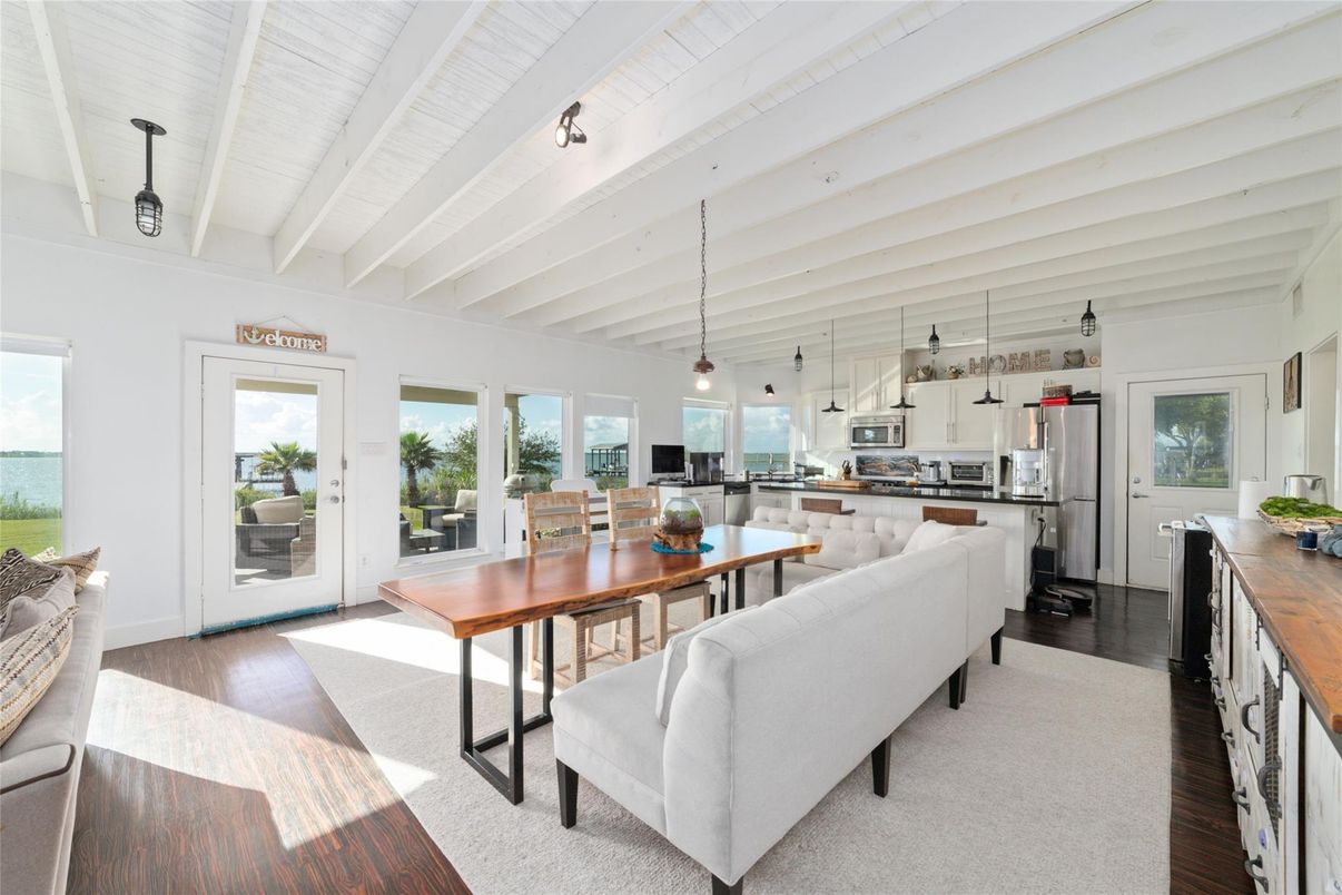 Dining room, Interior, Kitchen, Living room, Pendant Lights, Stainless Steel Appliances, Water, Wood Texture Flooring