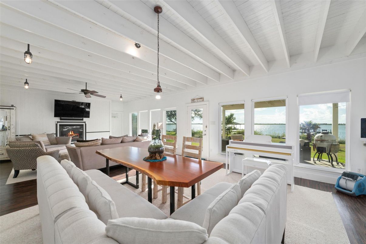 Dining room, Fireplace, Interior, Living room, Pendant Lights, Water, Wood Texture Flooring