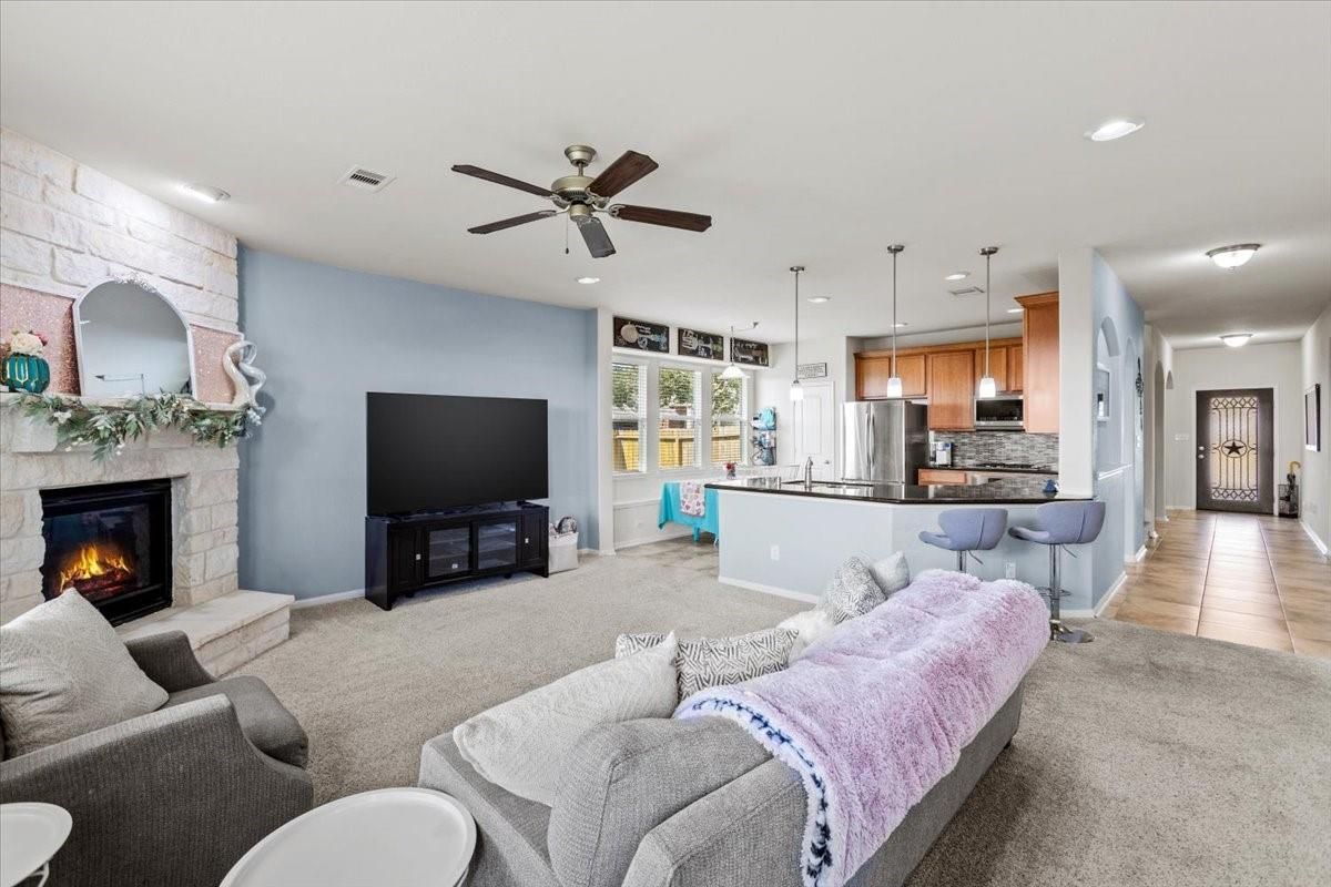 Fireplace, Interior, Kitchen, Living room, Pendant Lights, Recessed Lighting, Stainless Steel Appliances, Stone Walls