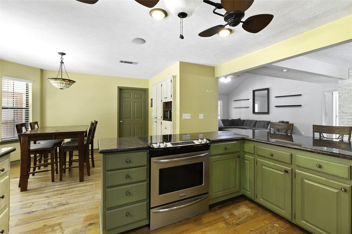 Dining room, Interior, Kitchen, Pendant Lights, Stainless Steel Appliances, Wood Texture Flooring