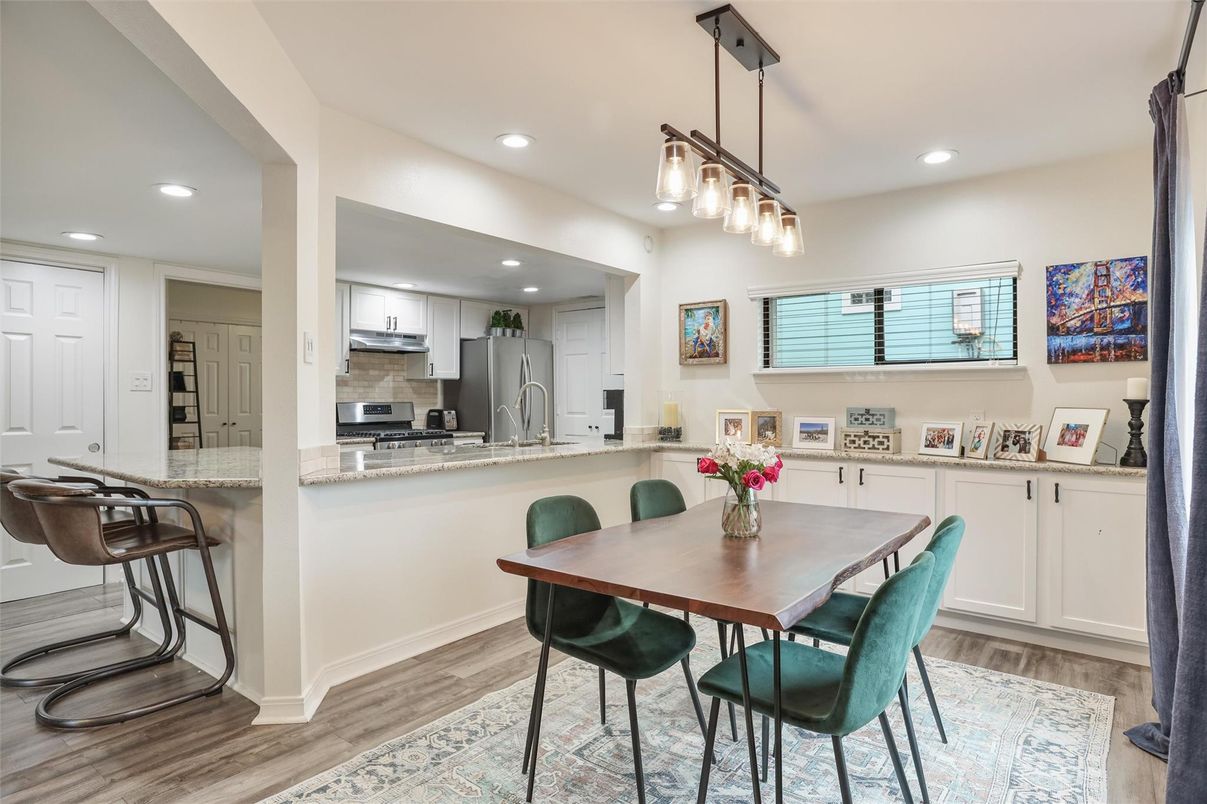 Dining room, Interior, Kitchen, Pendant Lights, Recessed Lighting, Stainless Steel Appliances, Wood Texture Flooring