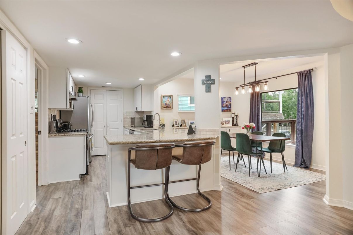 Dining room, Interior, Kitchen, Pendant Lights, Recessed Lighting, Stainless Steel Appliances, Wood Texture Flooring