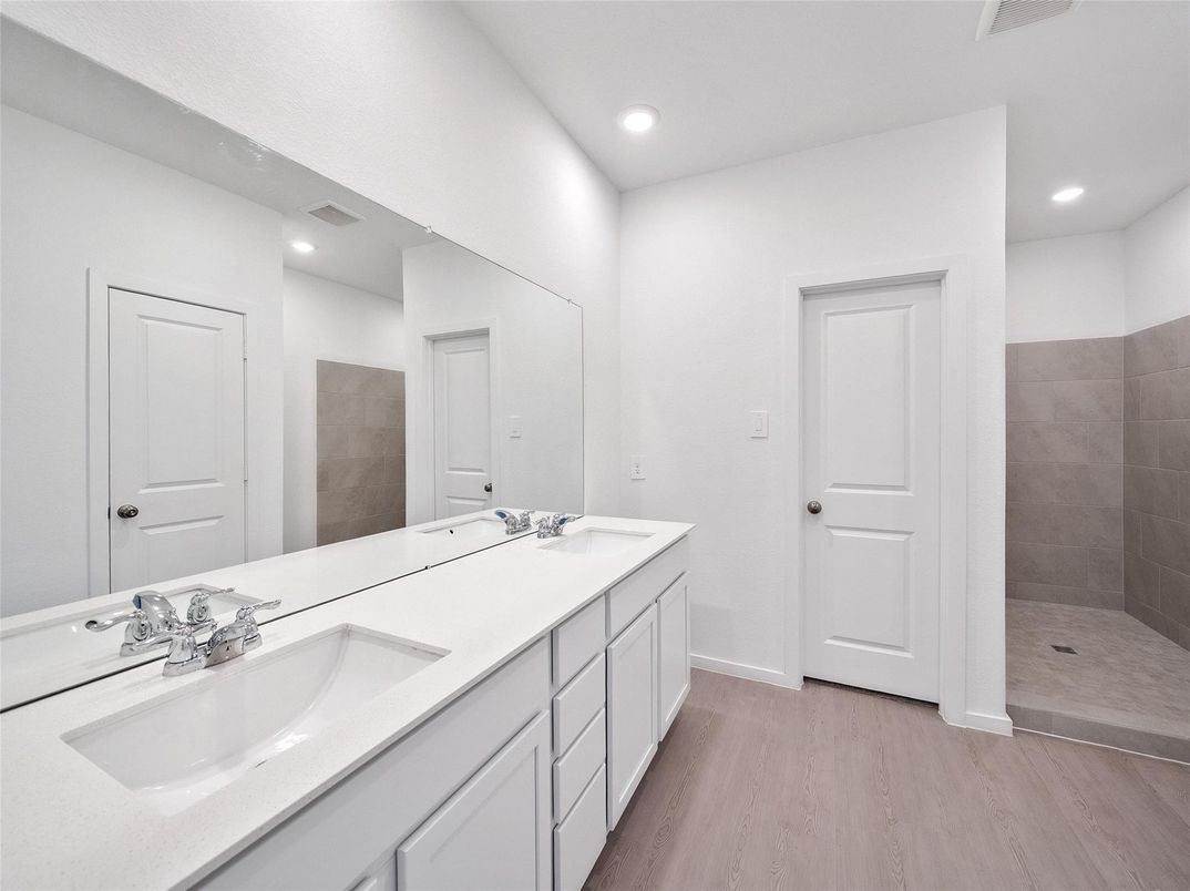 Bathroom, Dual Sink Vanities, Interior, Recessed Lighting, Wood Texture Flooring