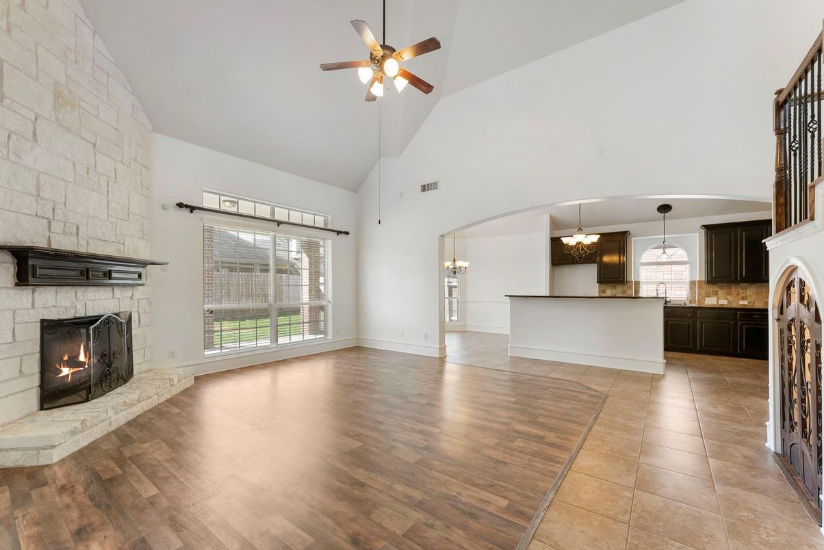 Chandelier, Empty room, Fireplace, Interior, Kitchen, Pendant Lights, Stone Walls, Wood Texture Flooring