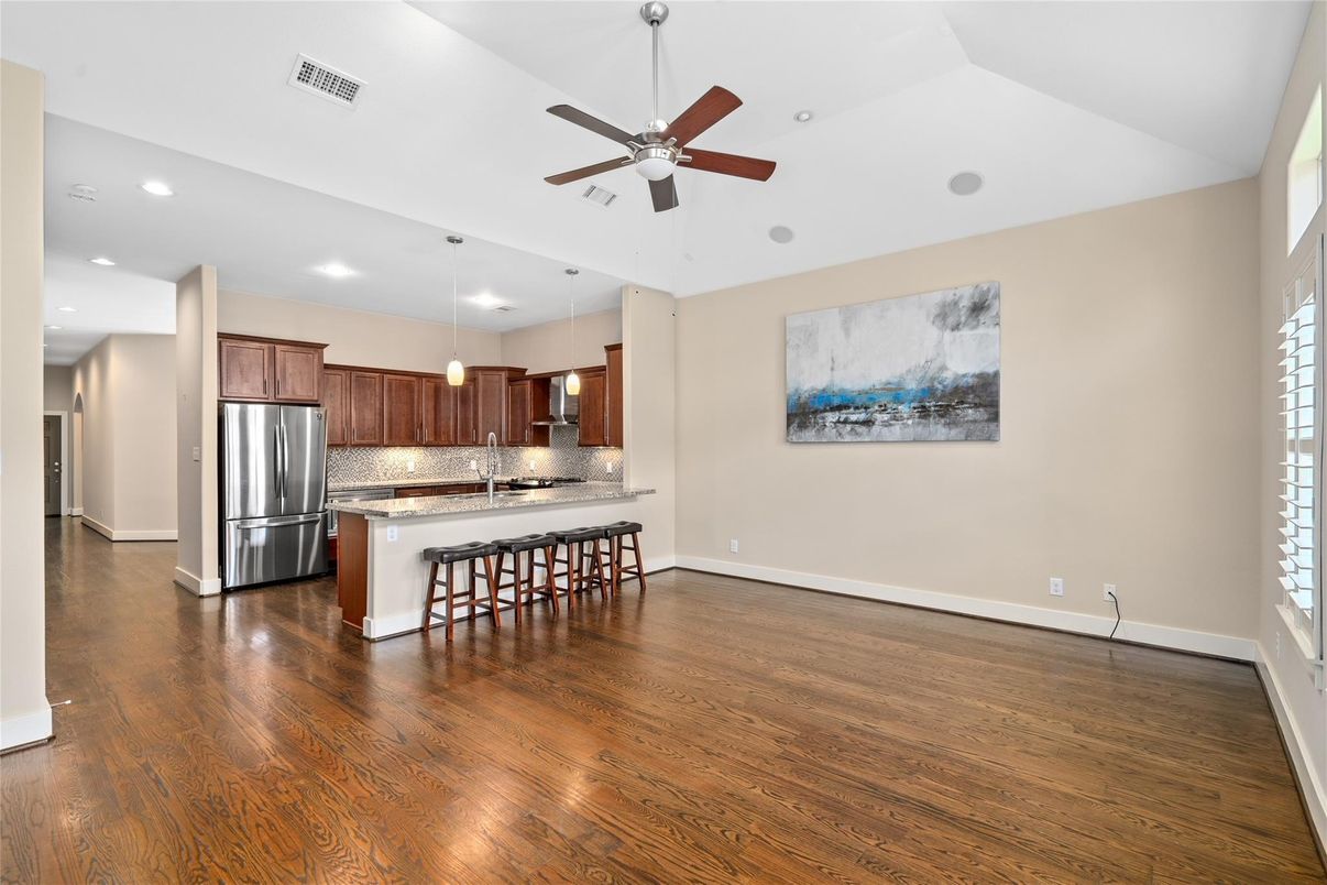 Empty room, Interior, Kitchen, Pendant Lights, Recessed Lighting, Stainless Steel Appliances, Wood Texture Flooring