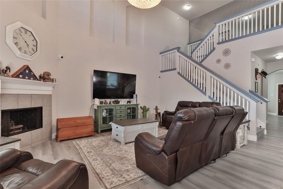 Chandelier, Fireplace, Interior, Living room, Recessed Lighting, Wood Texture Flooring