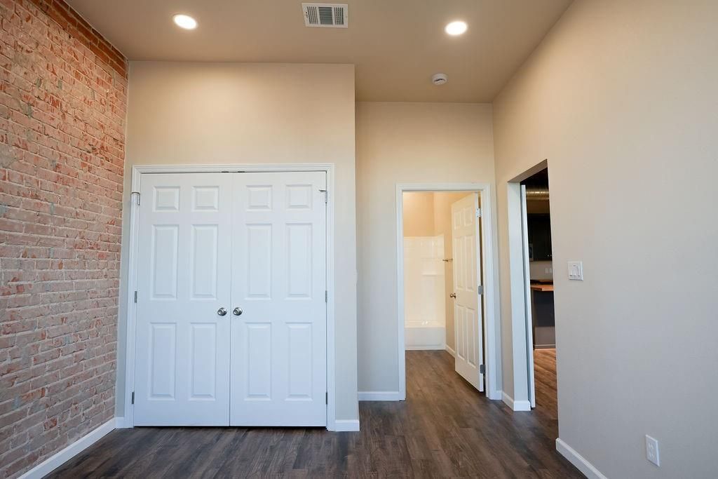 Empty room, Interior, Recessed Lighting, Stone Walls, Wood Texture Flooring