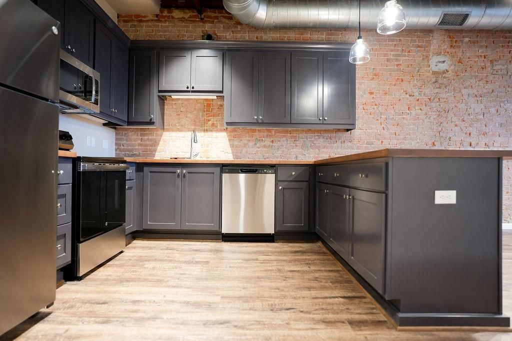 Interior, Kitchen, Pendant Lights, Stainless Steel Appliances, Stone Walls, Wood Texture Flooring