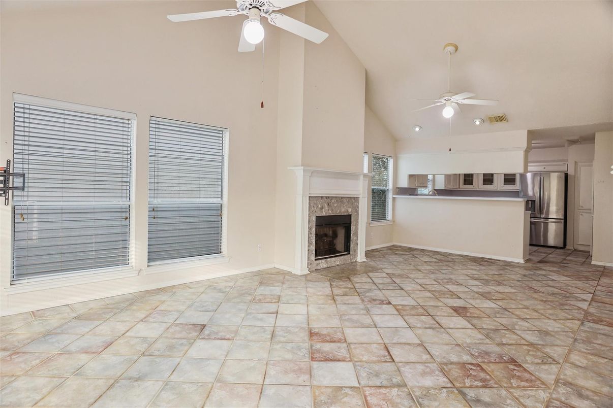 Empty room, Fireplace, Interior, Kitchen, Recessed Lighting, Stainless Steel Appliances