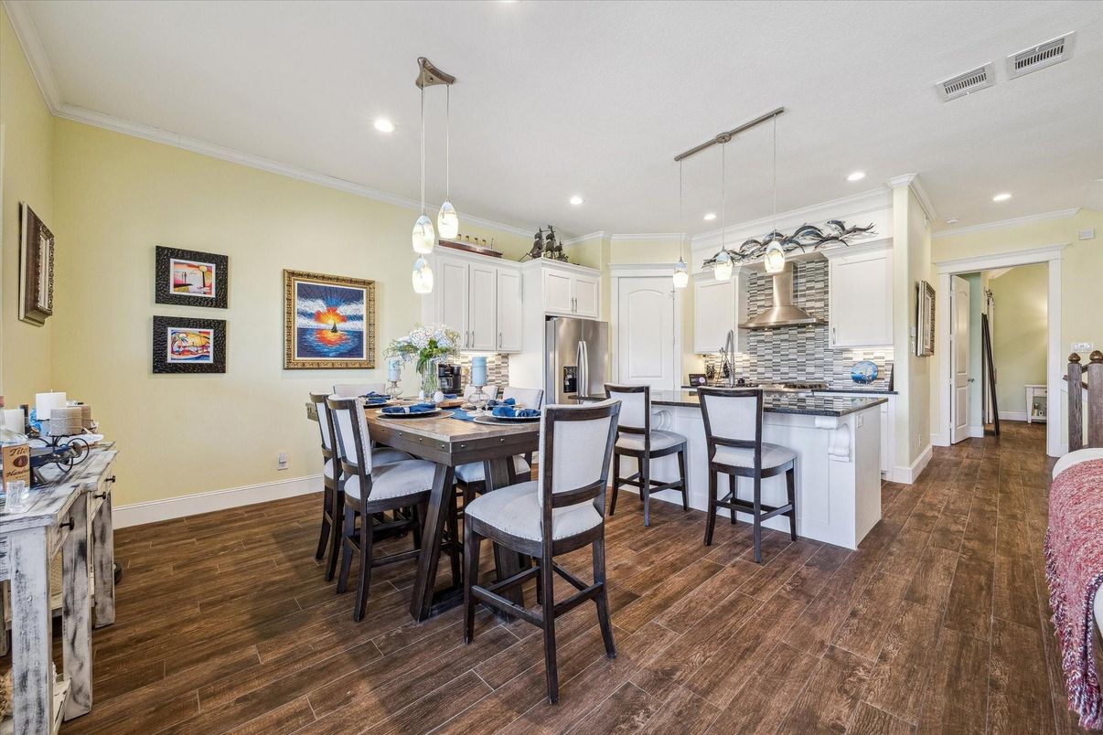 Dining room, Interior, Kitchen, Pendant Lights, Recessed Lighting, Stainless Steel Appliances, Wood Texture Flooring