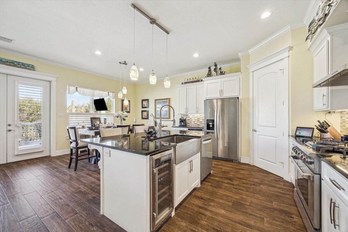 Dining room, Interior, Kitchen, Pendant Lights, Recessed Lighting, Stainless Steel Appliances, Wood Texture Flooring