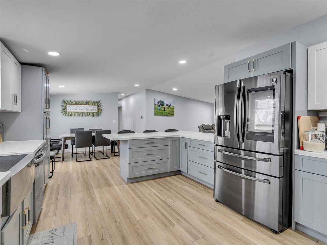 Dining room, Interior, Kitchen, Recessed Lighting, Stainless Steel Appliances, Wood Texture Flooring