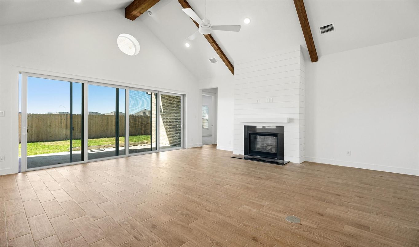 Empty room, Fireplace, Interior, Recessed Lighting, Wooden Beams, Wood Texture Flooring