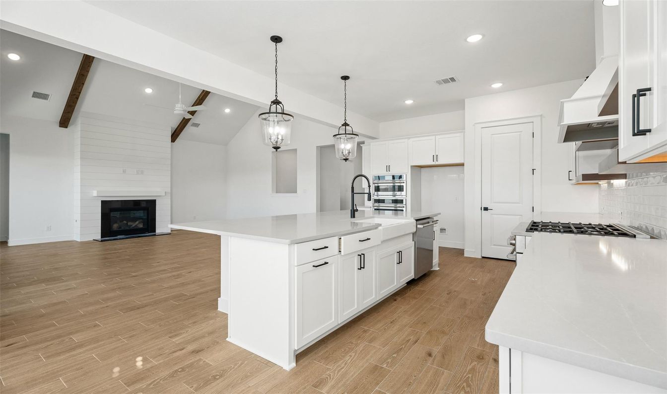 Fireplace, Interior, Kitchen, Pendant Lights, Recessed Lighting, Stainless Steel Appliances, Wooden Beams, Wood Texture Flooring