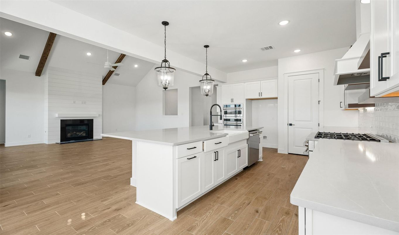 Fireplace, Interior, Kitchen, Pendant Lights, Recessed Lighting, Stainless Steel Appliances, Wooden Beams, Wood Texture Flooring