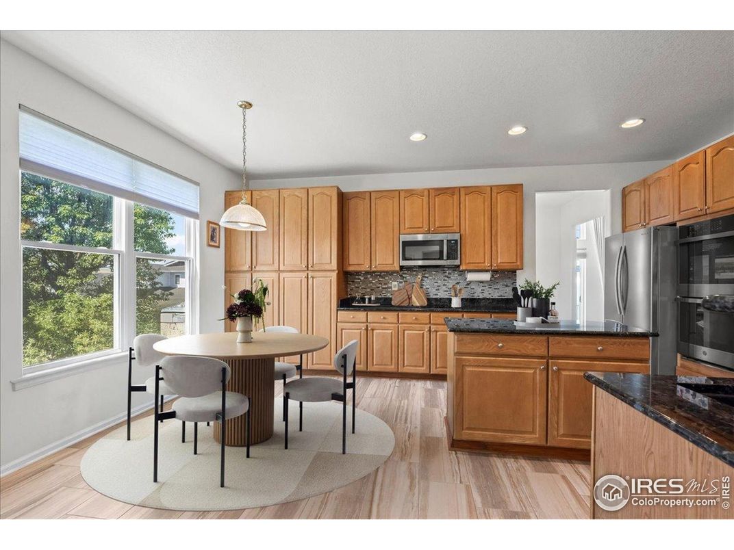 Dining room, Interior, Kitchen, Pendant Lights, Recessed Lighting, Stainless Steel Appliances, Wood Texture Flooring