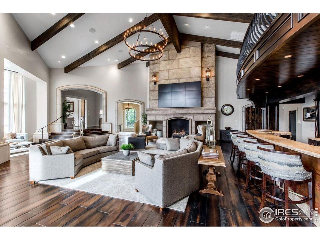 Chandelier, Dining room, Fireplace, Interior, Living room, Recessed Lighting, Stone Walls, Wooden Beams, Wood Texture Flooring