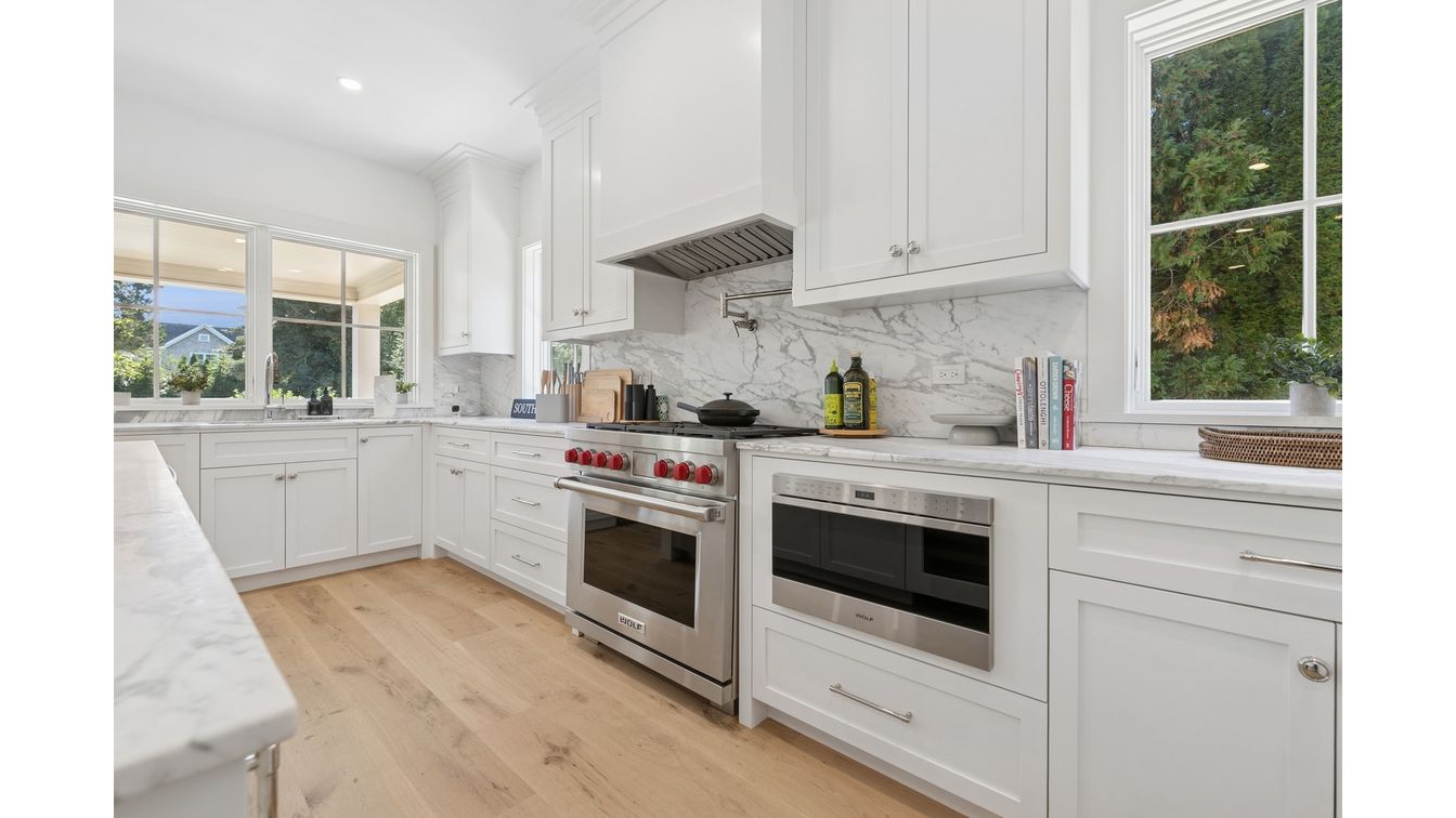 Interior, Kitchen, Marble Walls, Recessed Lighting, Stainless Steel Appliances, Wood Texture Flooring