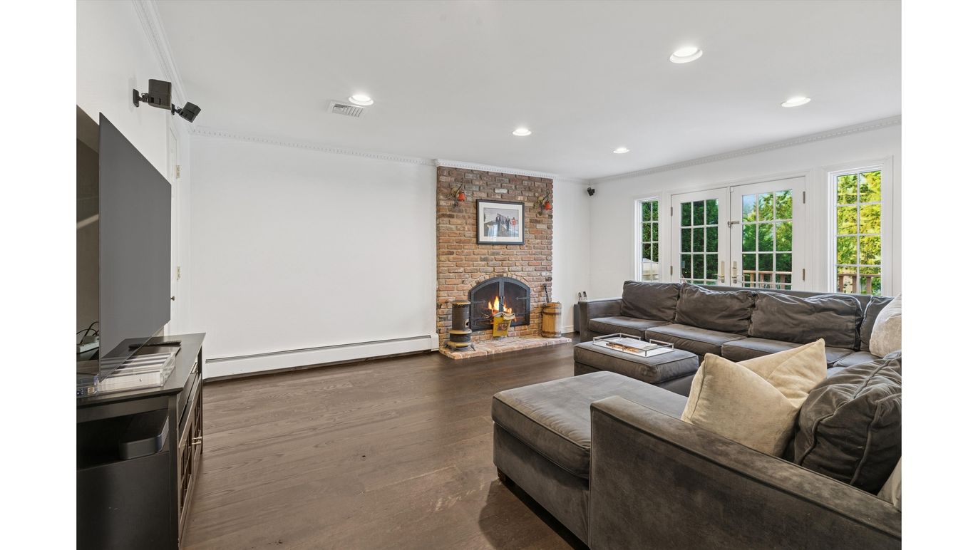 Fireplace, Interior, Living room, Recessed Lighting, Stone Walls, Wood Texture Flooring