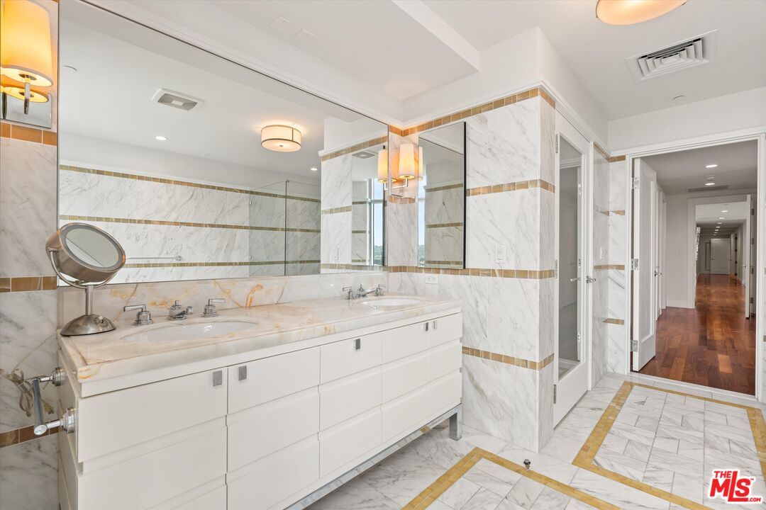 Bathroom, Dual Sink Vanities, Interior, Marble, Marble Walls, Recessed Lighting, Wood Texture Flooring