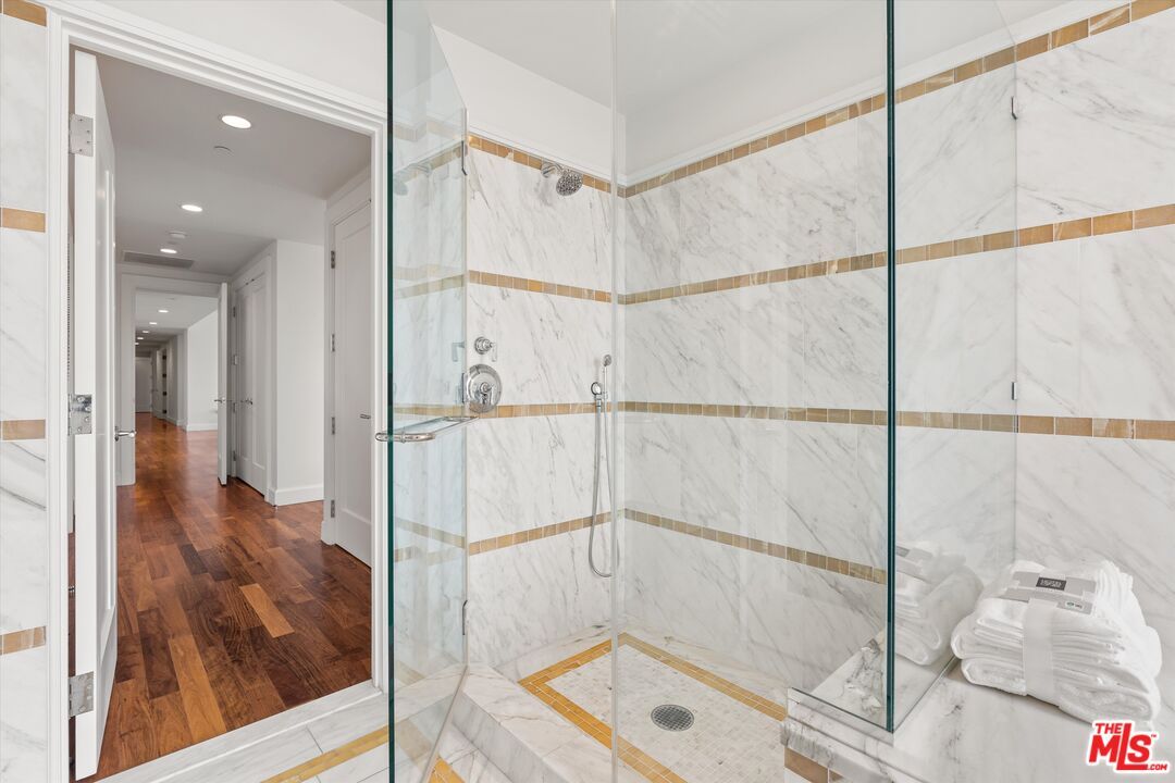 Bathroom, Glass Shower, Interior, Marble Walls, Recessed Lighting, Wood Texture Flooring