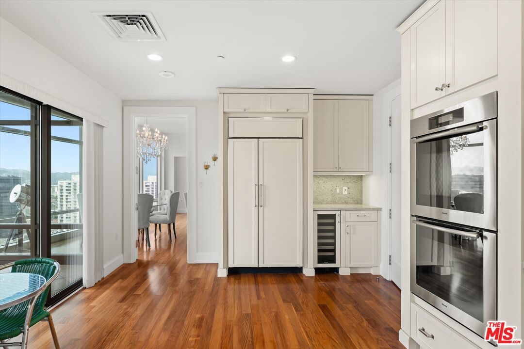 Chandelier, Dining room, Interior, Kitchen, Recessed Lighting, Stainless Steel Appliances, Wood Texture Flooring
