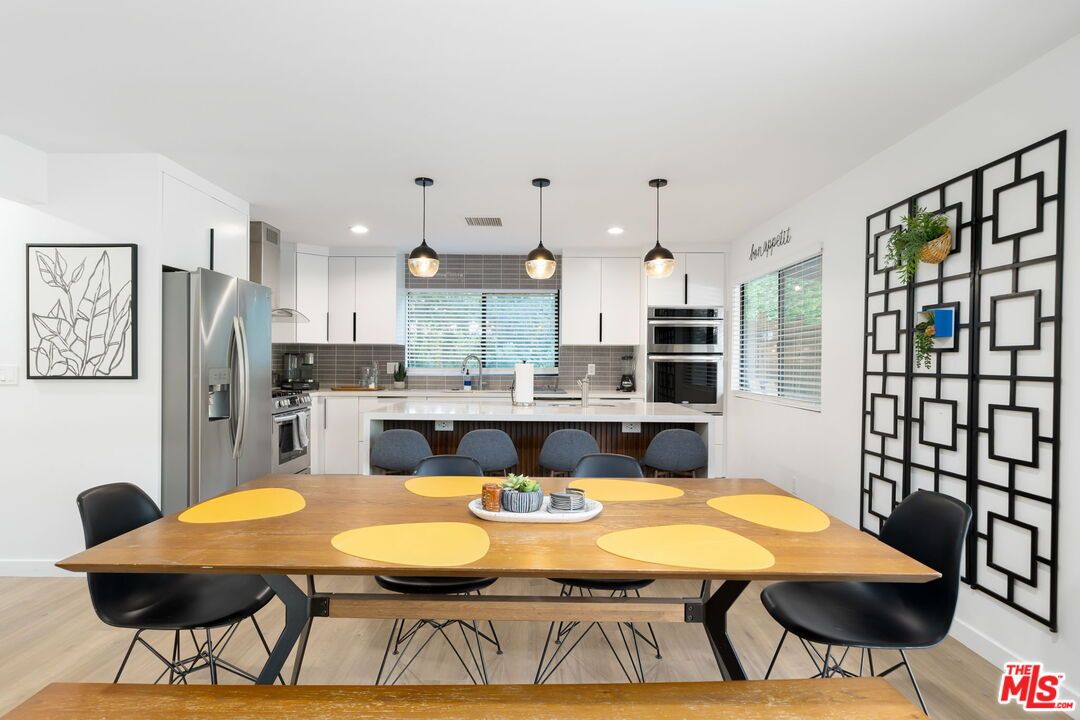 Dining room, Interior, Kitchen, Pendant Lights, Recessed Lighting, Stainless Steel Appliances, Wood Texture Flooring