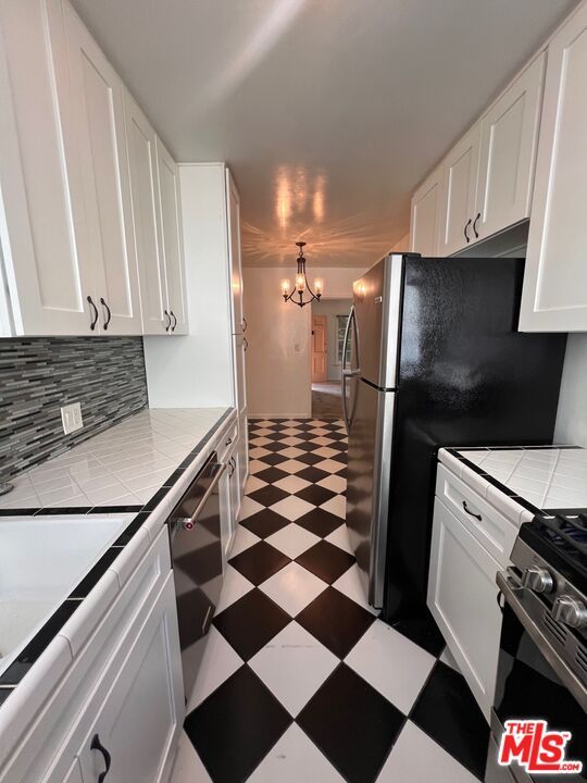 Chandelier, Interior, Kitchen, Stainless Steel Appliances, Tile Countertops