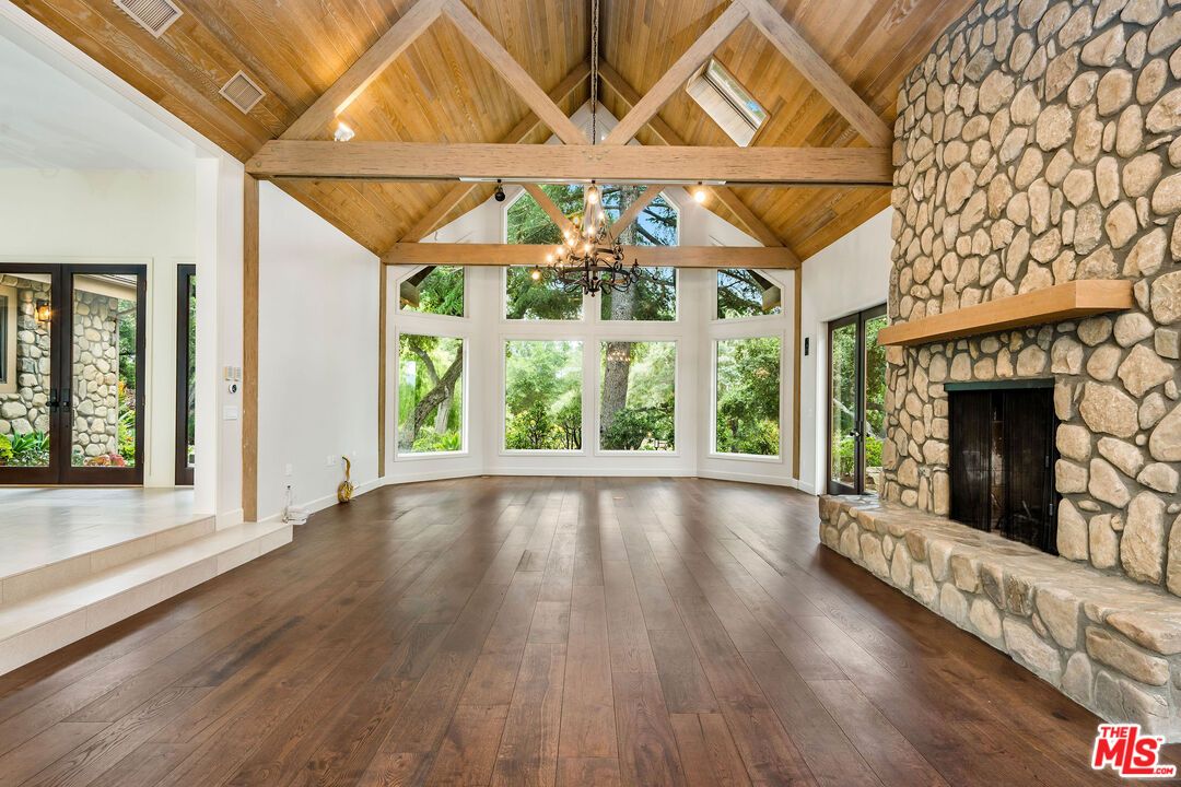 Chandelier, Empty room, Fireplace, Interior, Stone Walls, Wooden Beams, Wooden Ceilings, Wood Texture Flooring