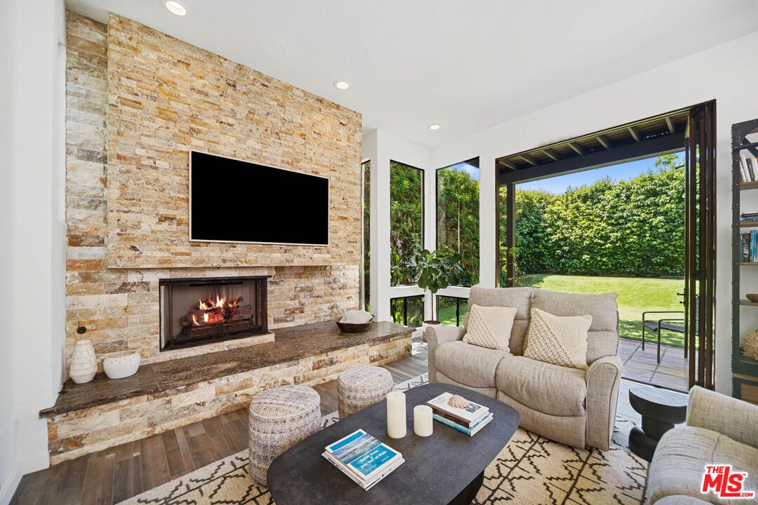 Fireplace, Interior, Living room, Recessed Lighting, Stone Walls, Wood Texture Flooring