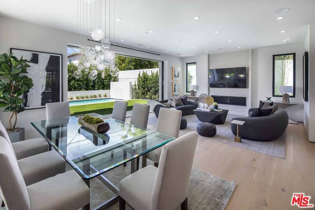 Dining room, Fireplace, Interior, Living room, Pendant Lights, Recessed Lighting, Wood Texture Flooring