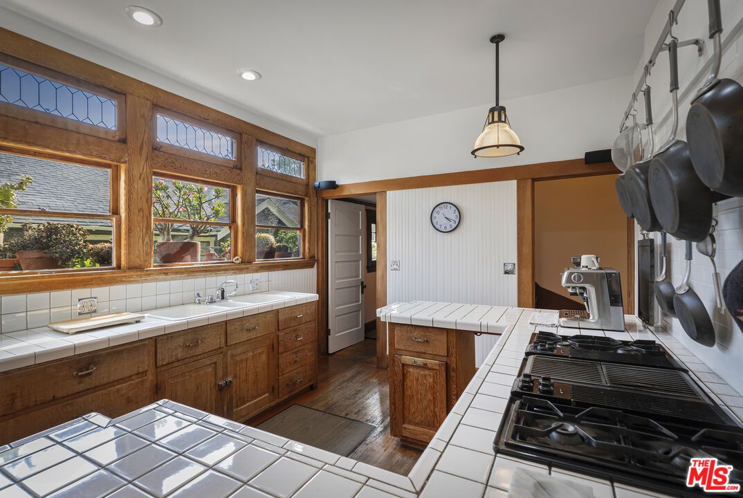 Interior, Kitchen, Pendant Lights, Recessed Lighting, Tile Countertops, Wood Texture Flooring