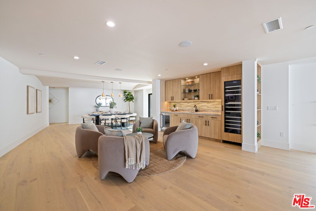 Dining room, Interior, Kitchen, Living room, Pendant Lights, Recessed Lighting, Stainless Steel Appliances, Wood Texture Flooring