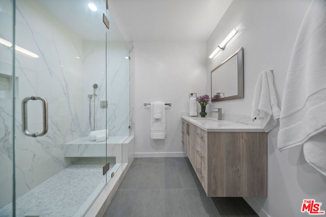 Bathroom, Dual Sink Vanities, Glass Shower, Interior, Marble Walls, Recessed Lighting