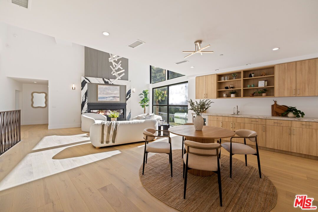Dining room, Fireplace, Interior, Living room, Recessed Lighting, Wood Texture Flooring