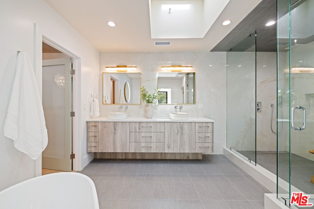 Bathroom, Dual Sink Vanities, Free Standing Baths, Glass Shower, Interior, Marble Walls, Recessed Lighting