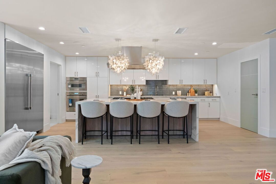 Chandelier, Interior, Kitchen, Pendant Lights, Recessed Lighting, Stainless Steel Appliances, Wood Texture Flooring