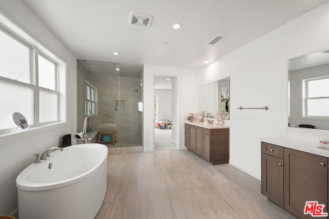 Bathroom, Dual Sink Vanities, Free Standing Baths, Glass Shower, Interior, Recessed Lighting, Wood Texture Flooring
