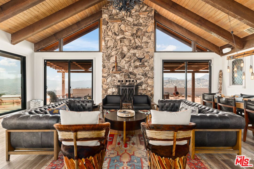 Dining room, Fireplace, Interior, Living room, Pendant Lights, Stone Walls, Water, Wooden Beams, Wooden Ceilings, Wood Texture Flooring