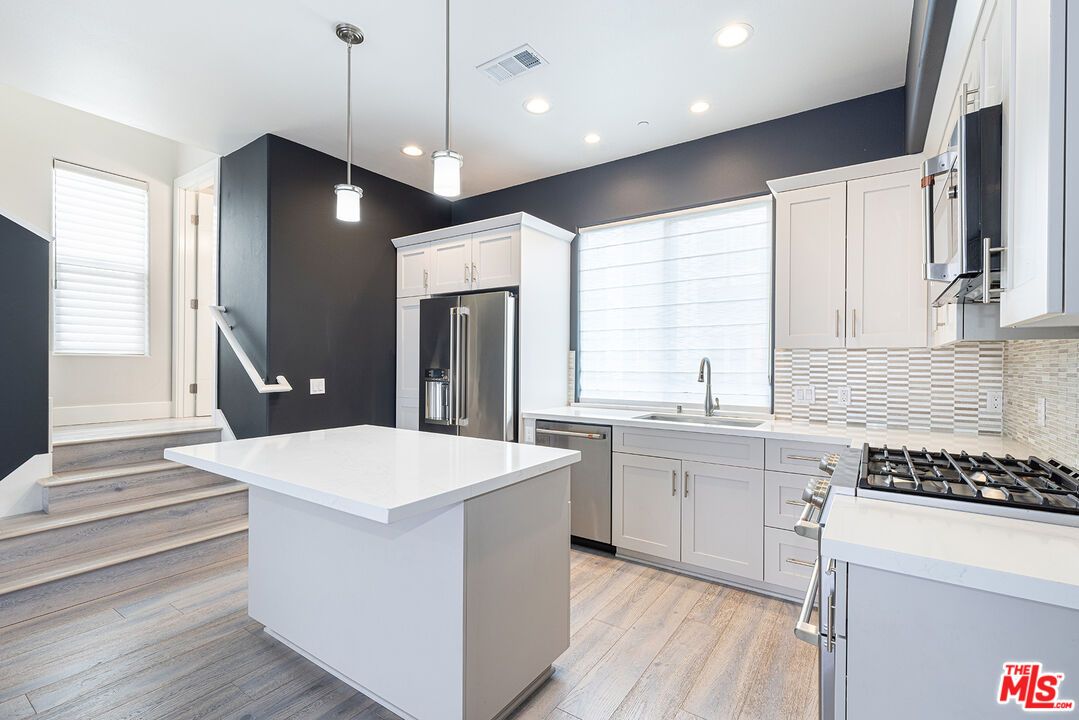 Interior, Kitchen, Pendant Lights, Recessed Lighting, Stainless Steel Appliances, Wood Texture Flooring