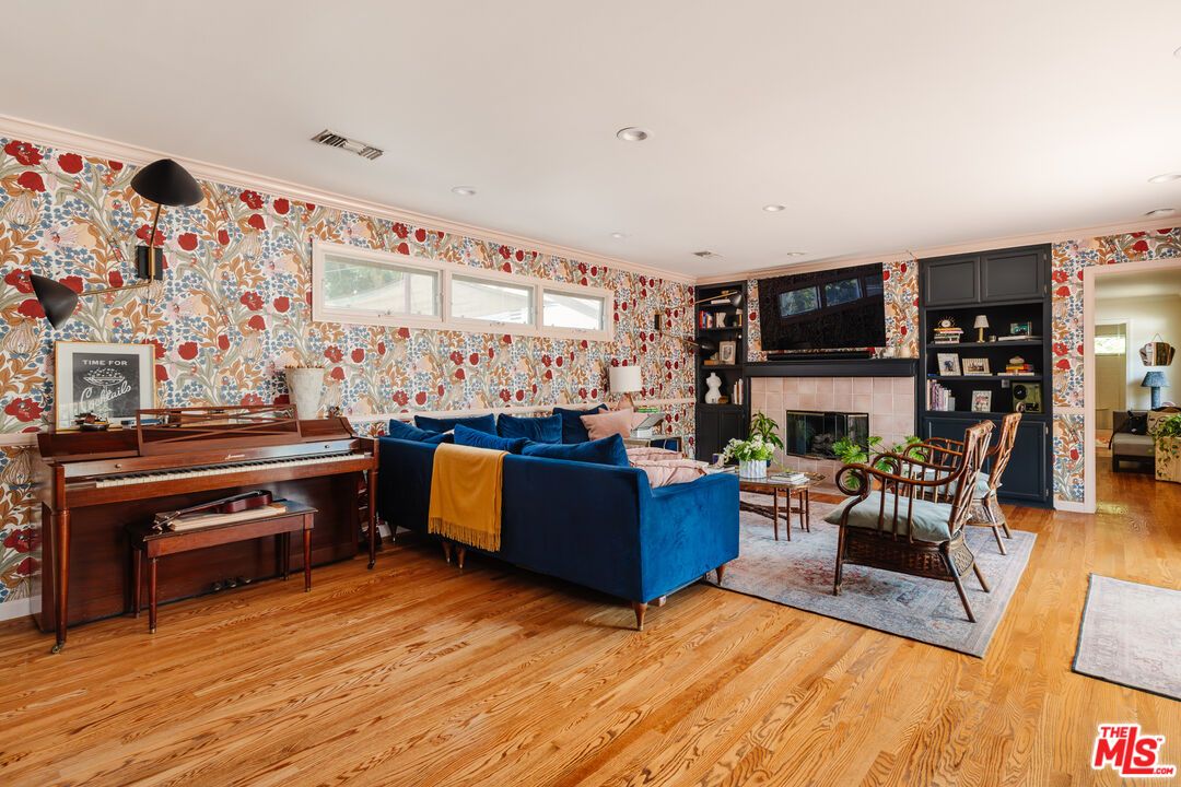 Fireplace, Interior, Living room, Piano, Recessed Lighting, Wood Texture Flooring