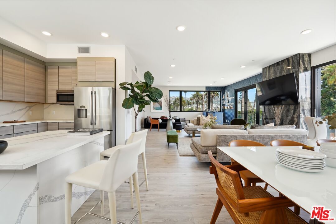 Dining room, Interior, Kitchen, Living room, Recessed Lighting, Stainless Steel Appliances, Wood Texture Flooring