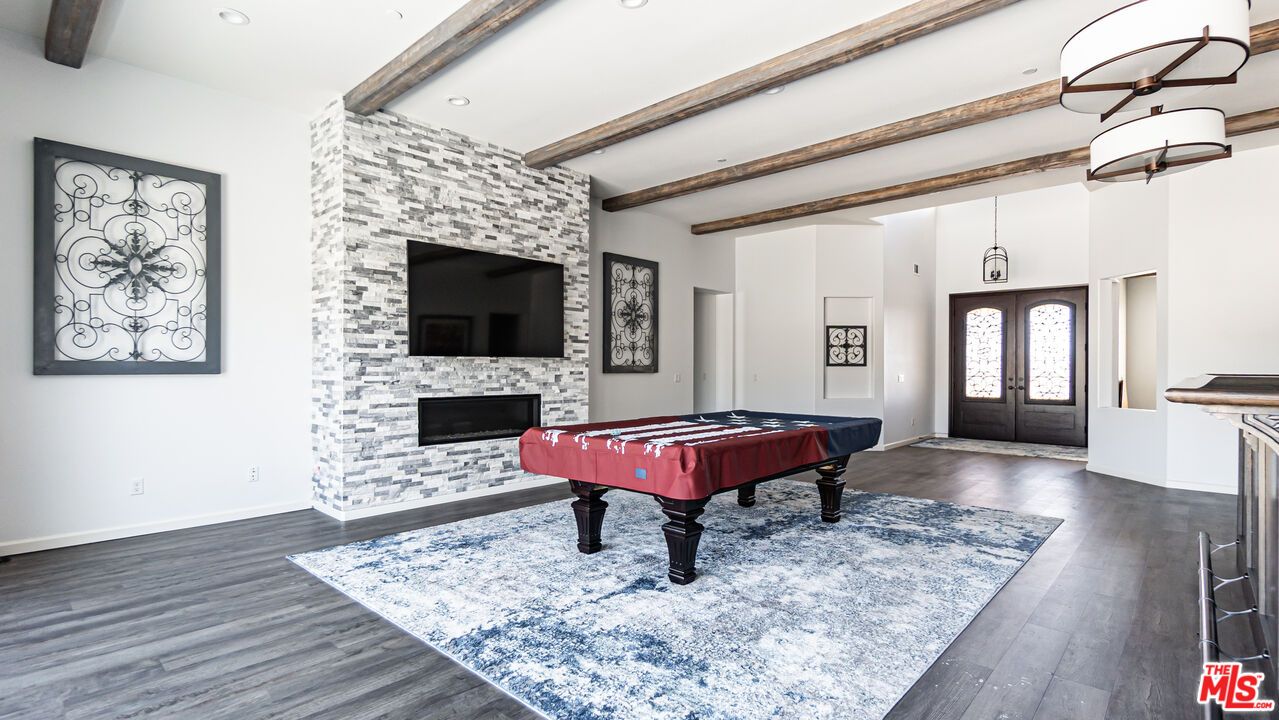 Billiard Table, Fireplace, Game Room, Interior, Pendant Lights, Recessed Lighting, Stone Walls, Wooden Beams, Wood Texture Flooring
