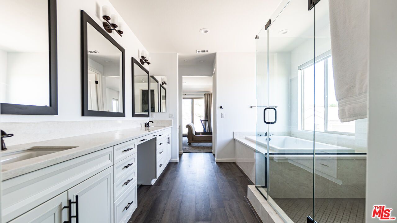 Bathroom, Dual Sink Vanities, Glass Shower, Interior, Recessed Lighting, Wood Texture Flooring